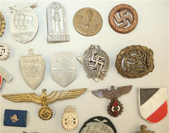 A large collection of various German Third Reich badges,